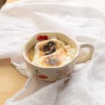 Earl Grey hot chocolate in a mug topped with torched marshmallow fluff.