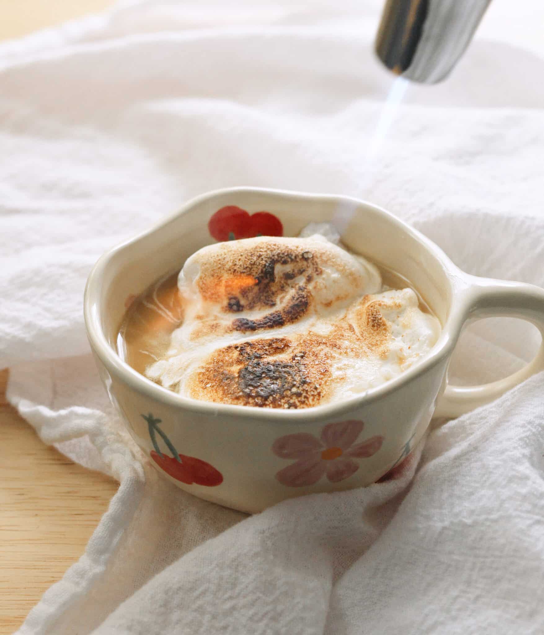 Torching marshmallow fluff on top of earl grey latte.