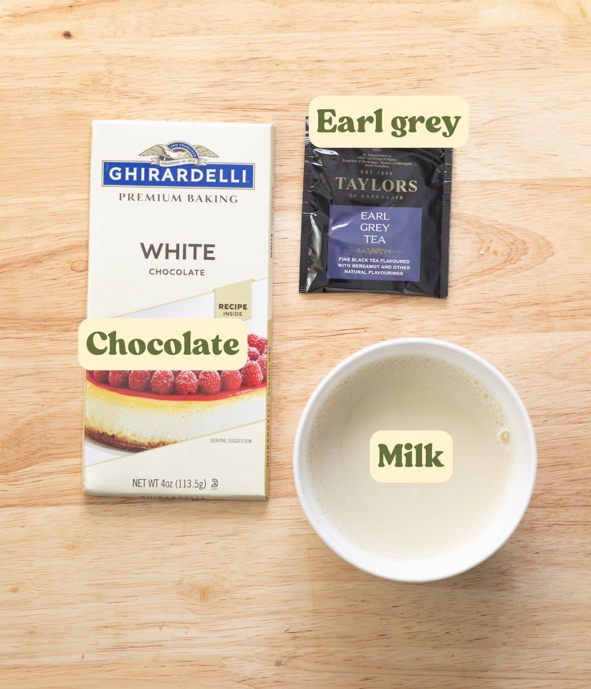 Earl grey hot cocoa labeled ingredients laid out on a wooden table.