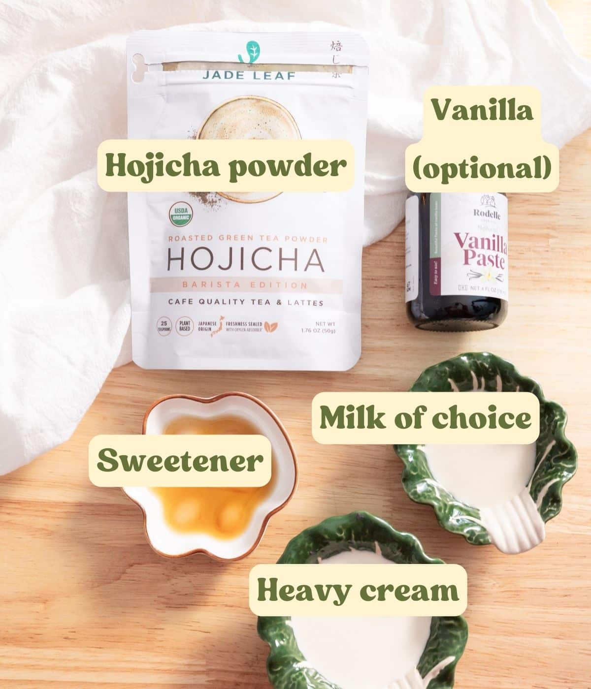 Hojicha cold foam labeled ingredients laid out on a wooden table.