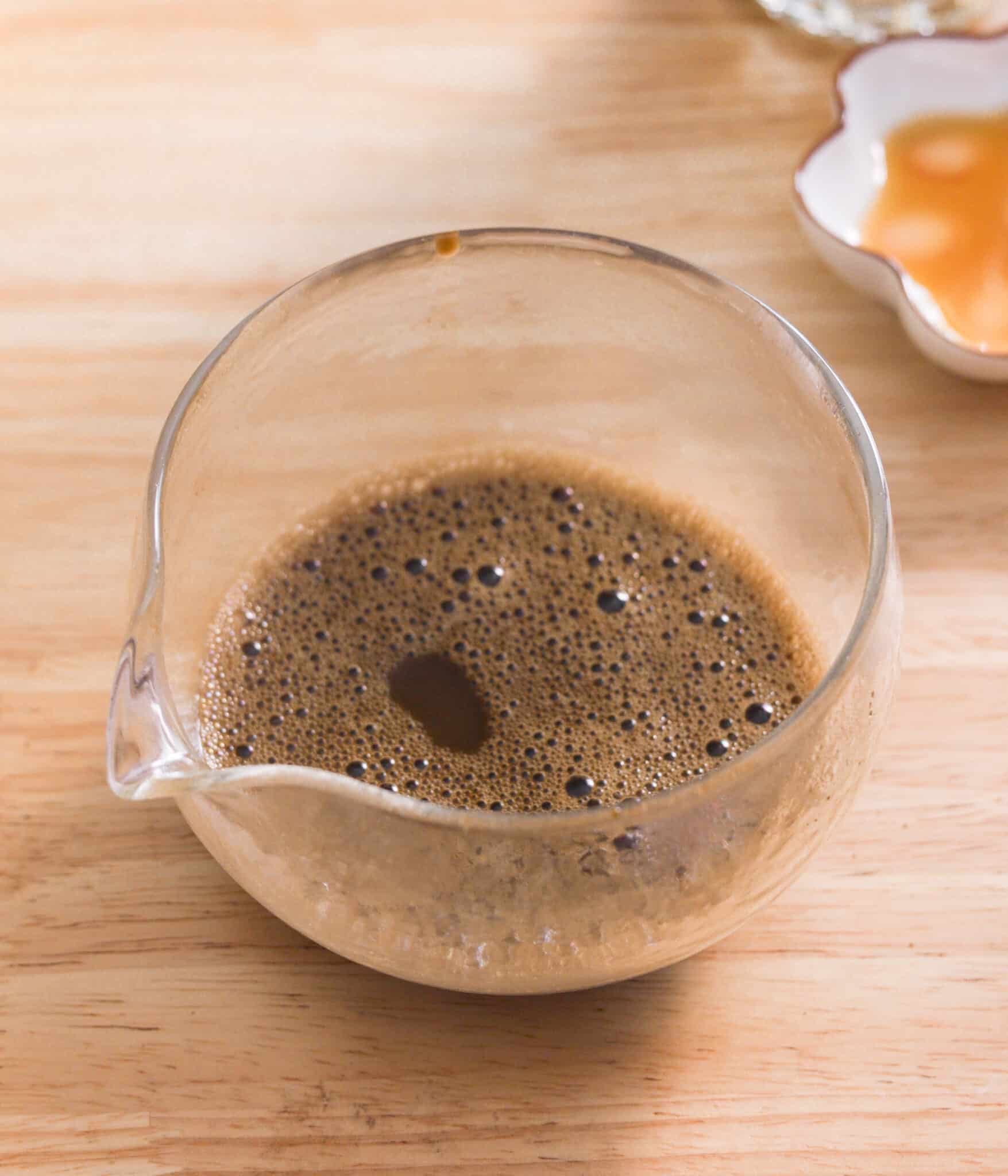 Hojicha powder fully mixed into hot water.