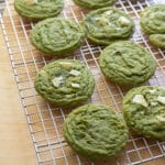 Matcha white chocolate cookies on a wire rack.