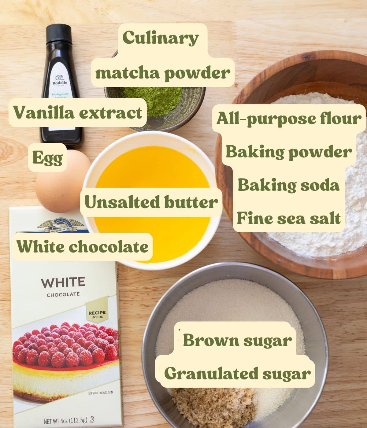Matcha white chocolate chip cookie labeled ingredients on a wooden table.