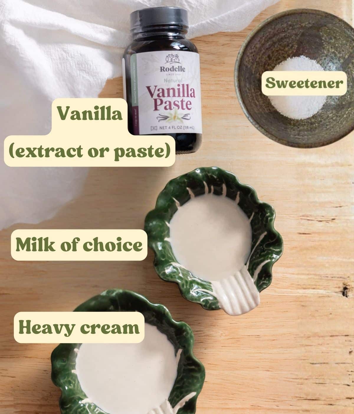 Vanilla cold foam labeled ingredients laid out on a wooden table.