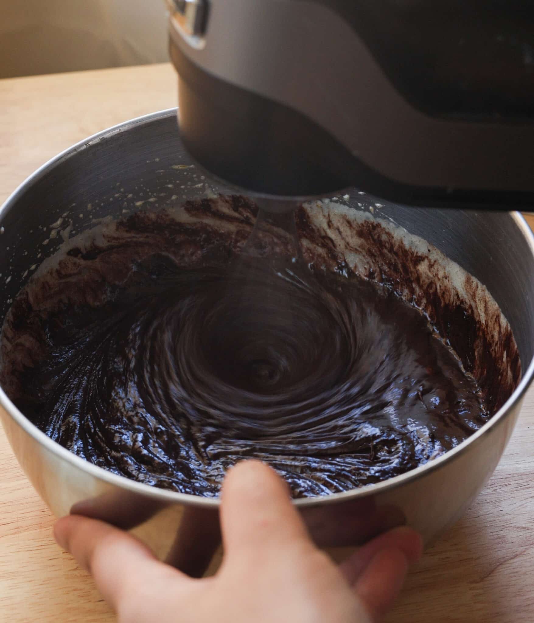 Chocolate mixture whipped together with the egg mixture in a bowl.