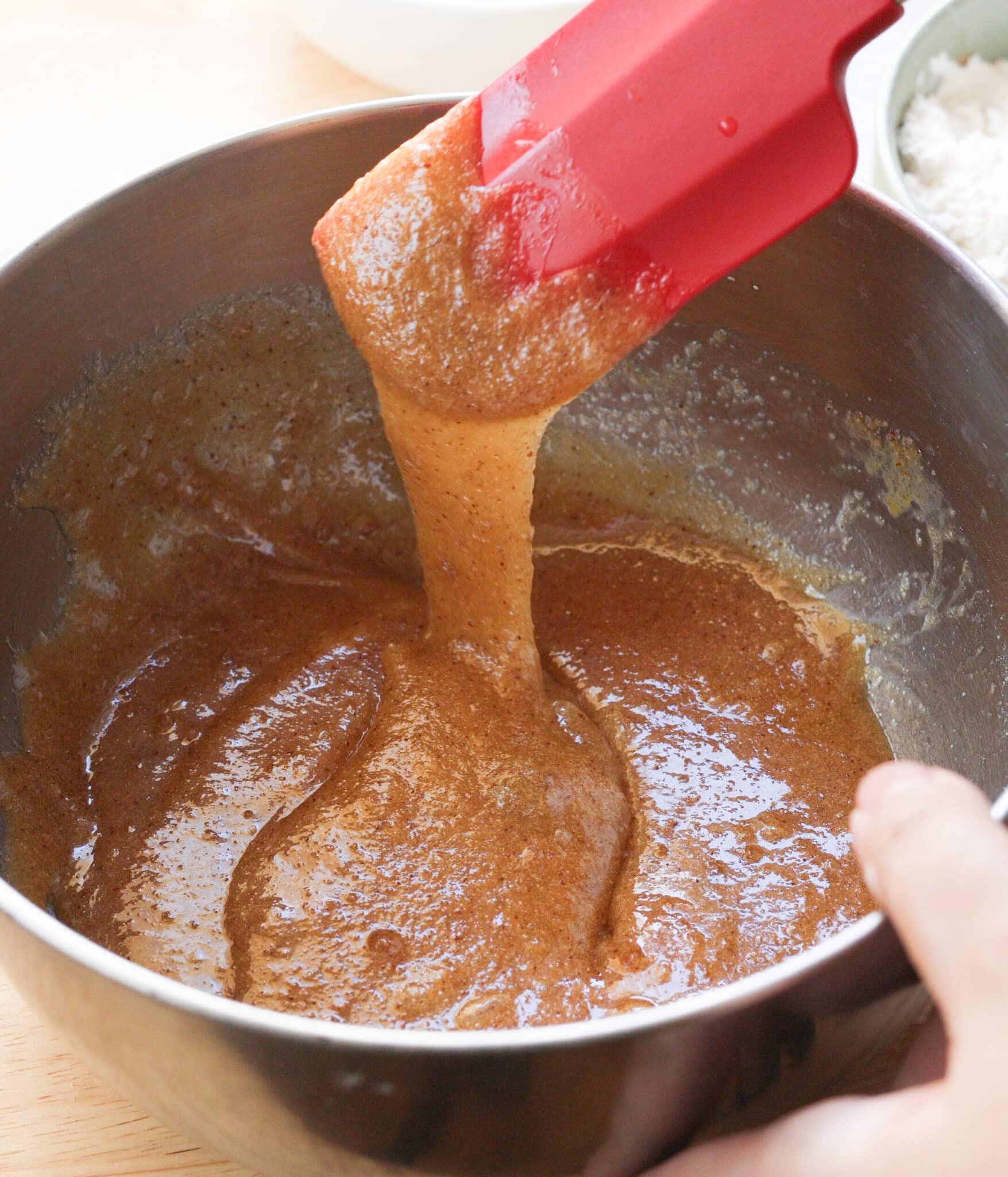 Wet ingredients fully combined in a mixing bowl.