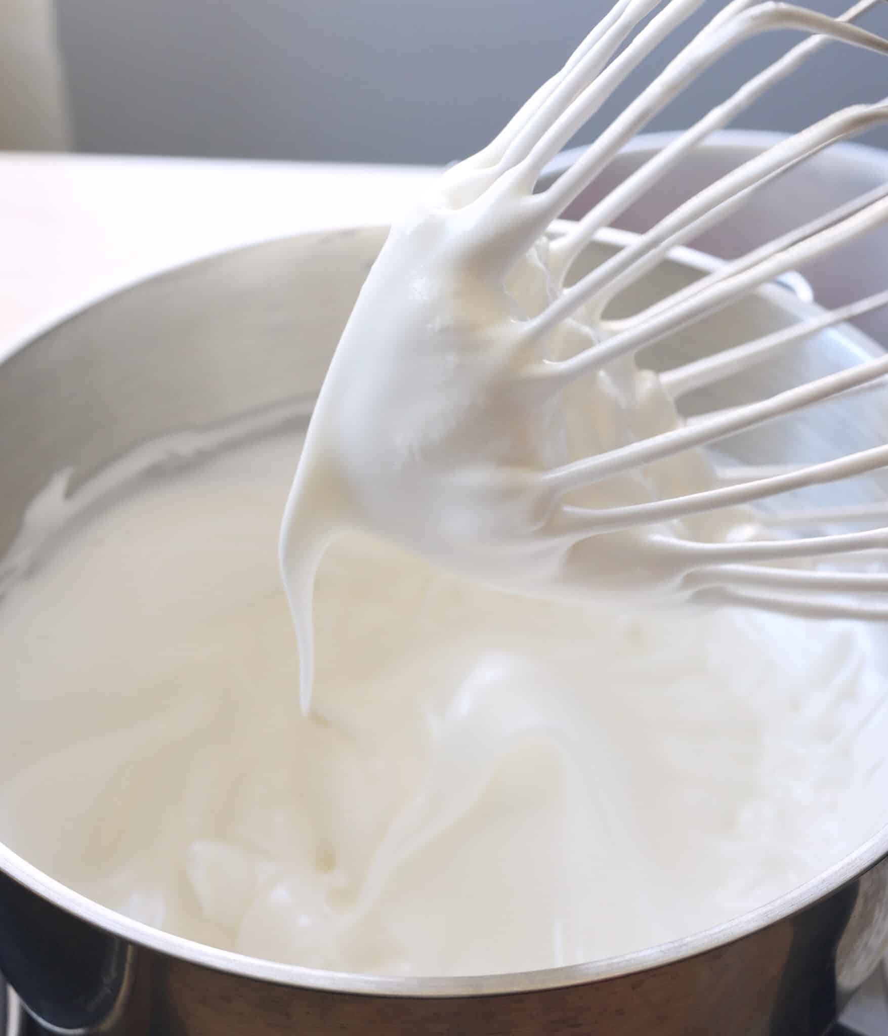 Whipped egg whites, sugar, and cream of tartar at medium peak stage.