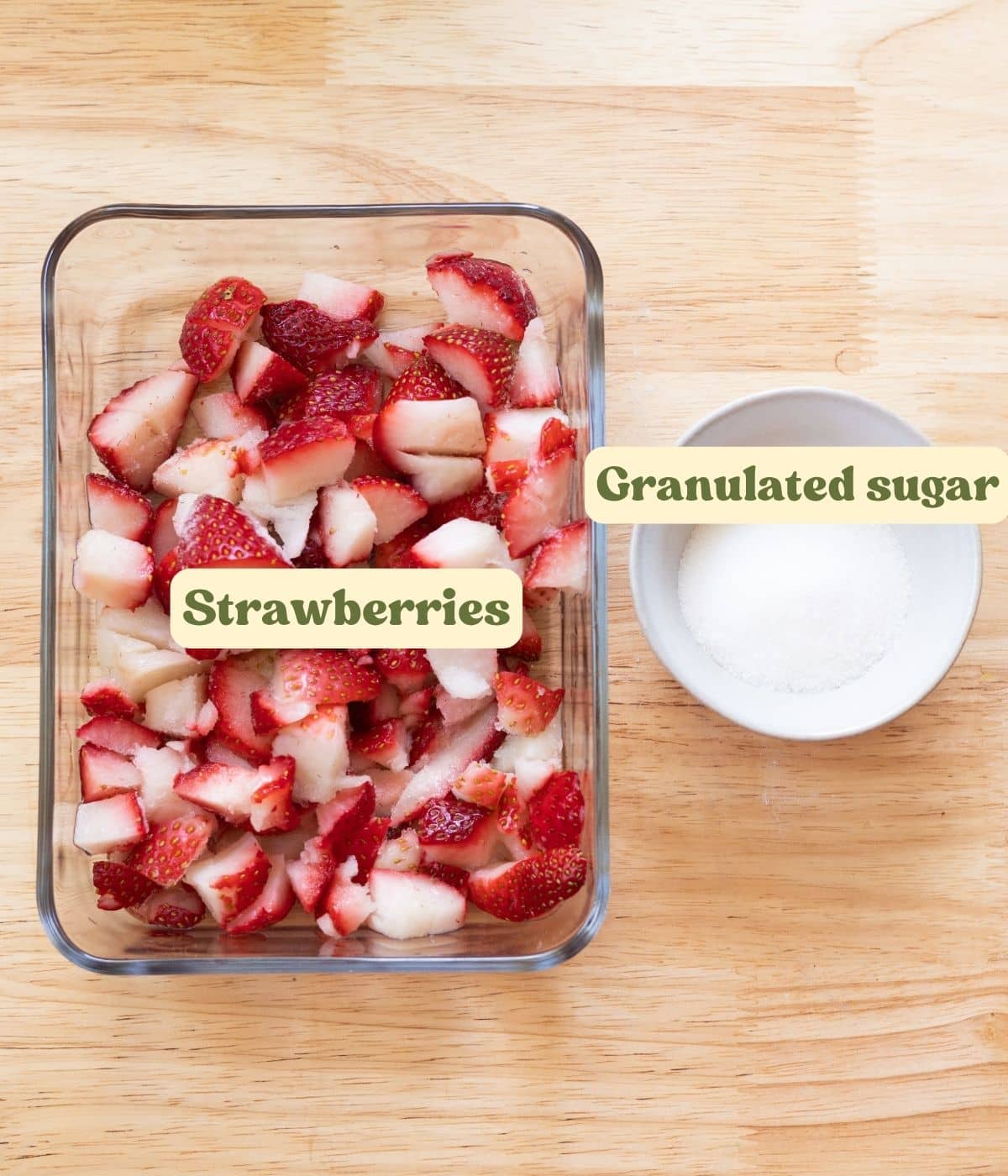 Macerated strawberry ingredients laid out on a wooden table, with labels for each ingredient.