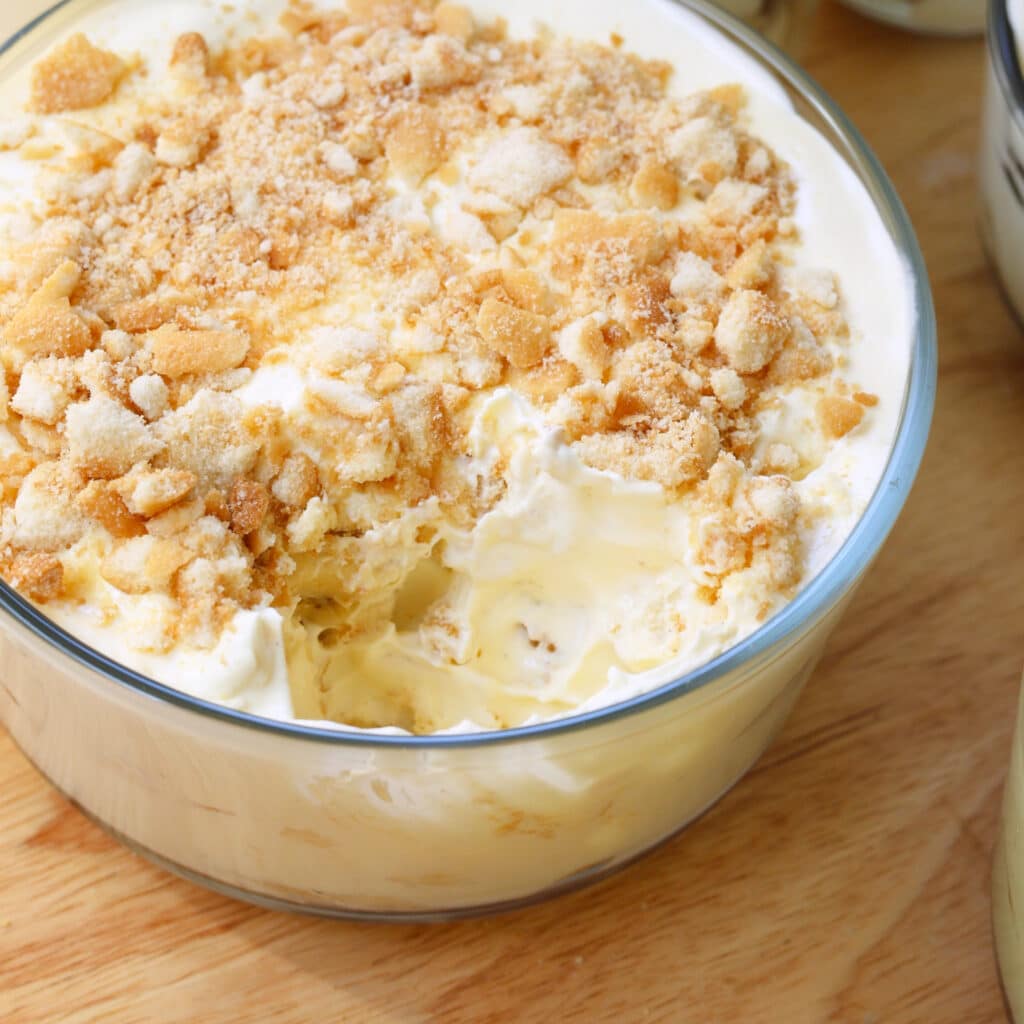 Homemade banana pudding in a glass container.