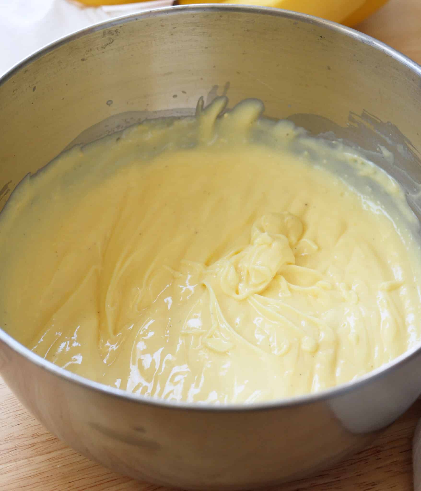 Mixed instant vanilla pudding in a stainless steel bowl.
