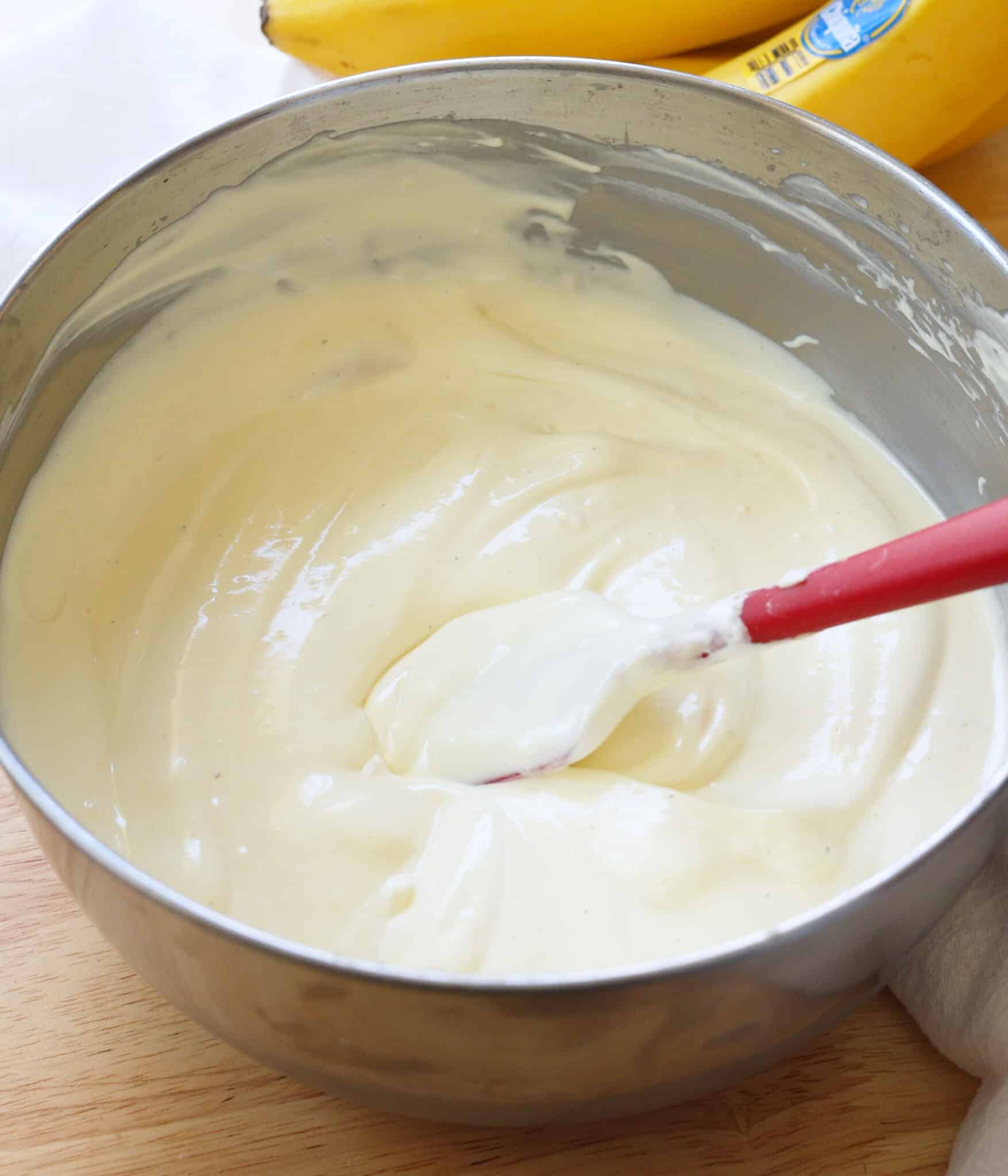 Light and creamy vanilla banana pudding mixture in a stainless steel bowl.
