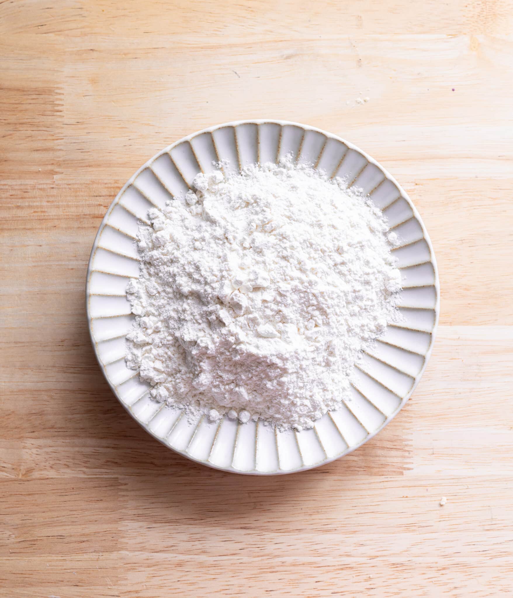 Heat treated flour on a fluted plate.