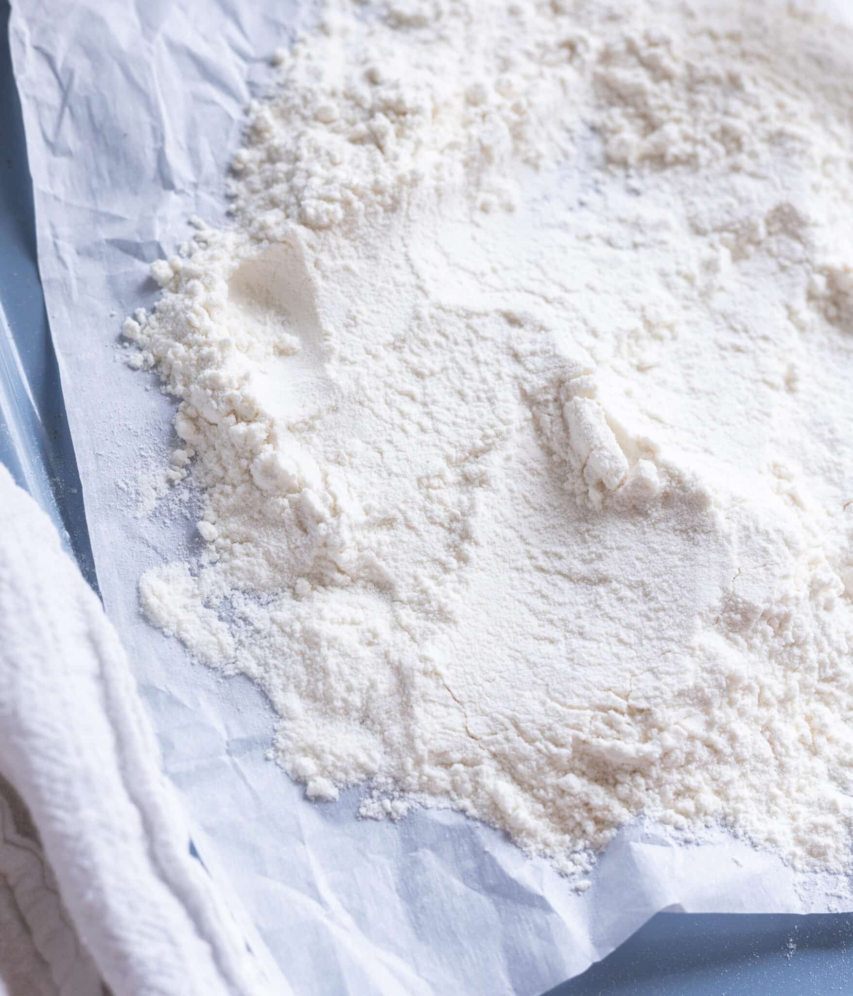 Heat treated flour on a lined baking sheet.