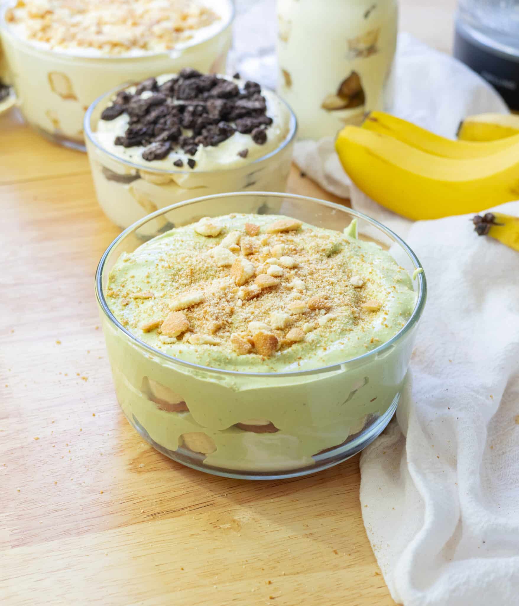 Matcha banana pudding in a glass container.