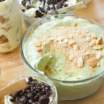 Matcha banana pudding in a glass container.