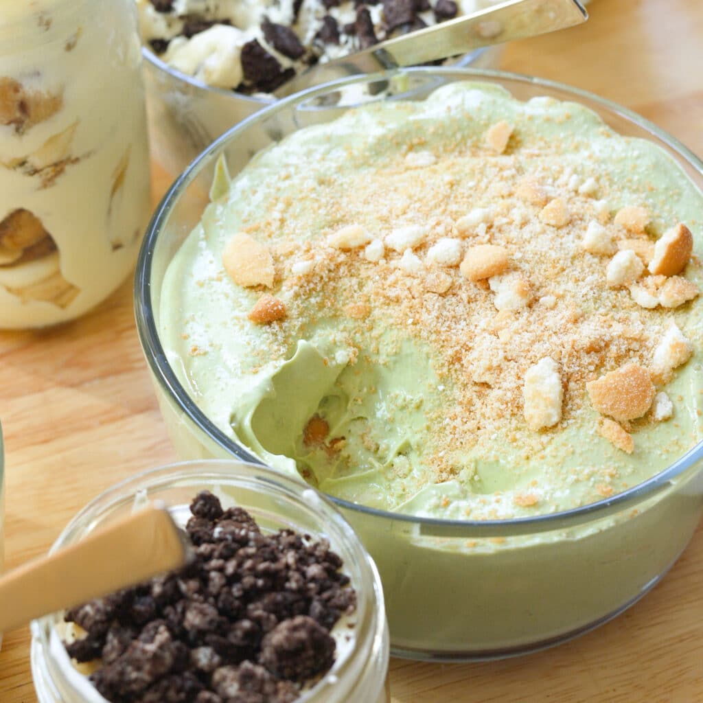 Matcha banana pudding in a glass container.