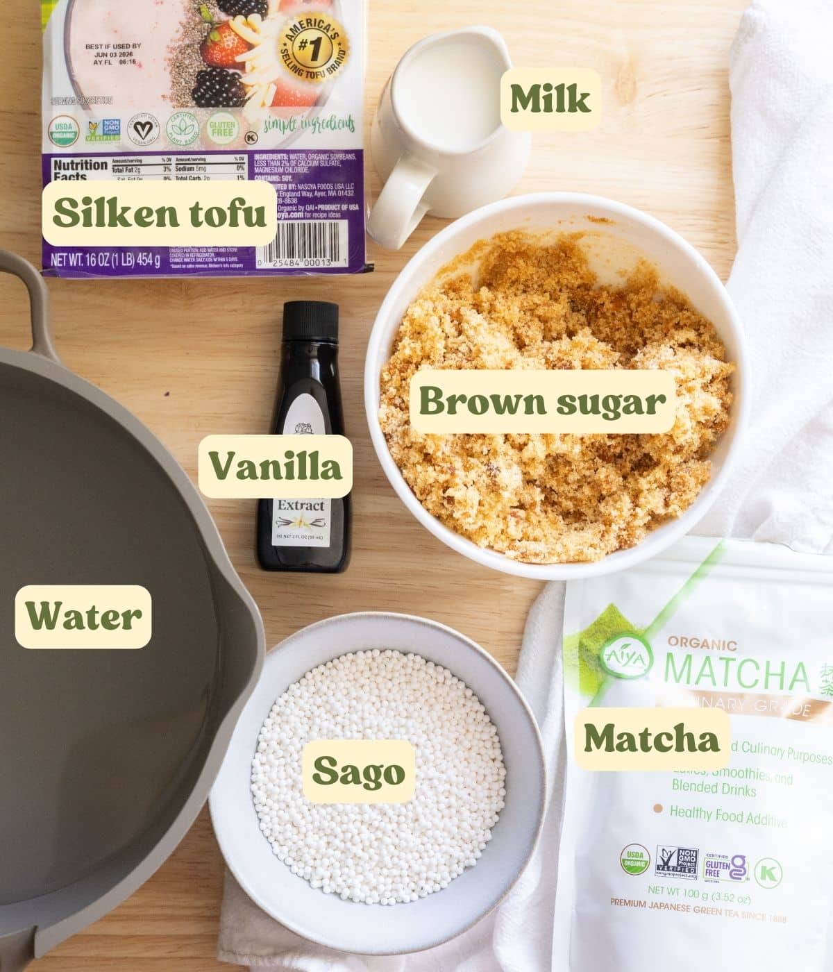 Filipino matcha flavored taho labeled ingredients on a wooden table.