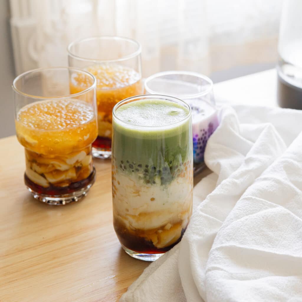 Matcha taho in a glass cup.