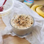 Earl grey banana pudding in a glass serving bowl.