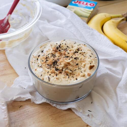 Earl grey banana pudding in a glass serving bowl.