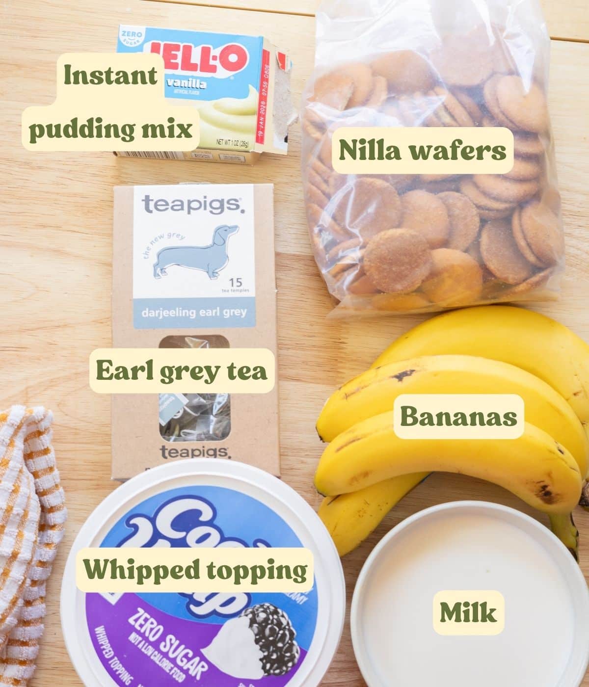 Homemade earl grey banana pudding labeled ingredients on a wooden table.