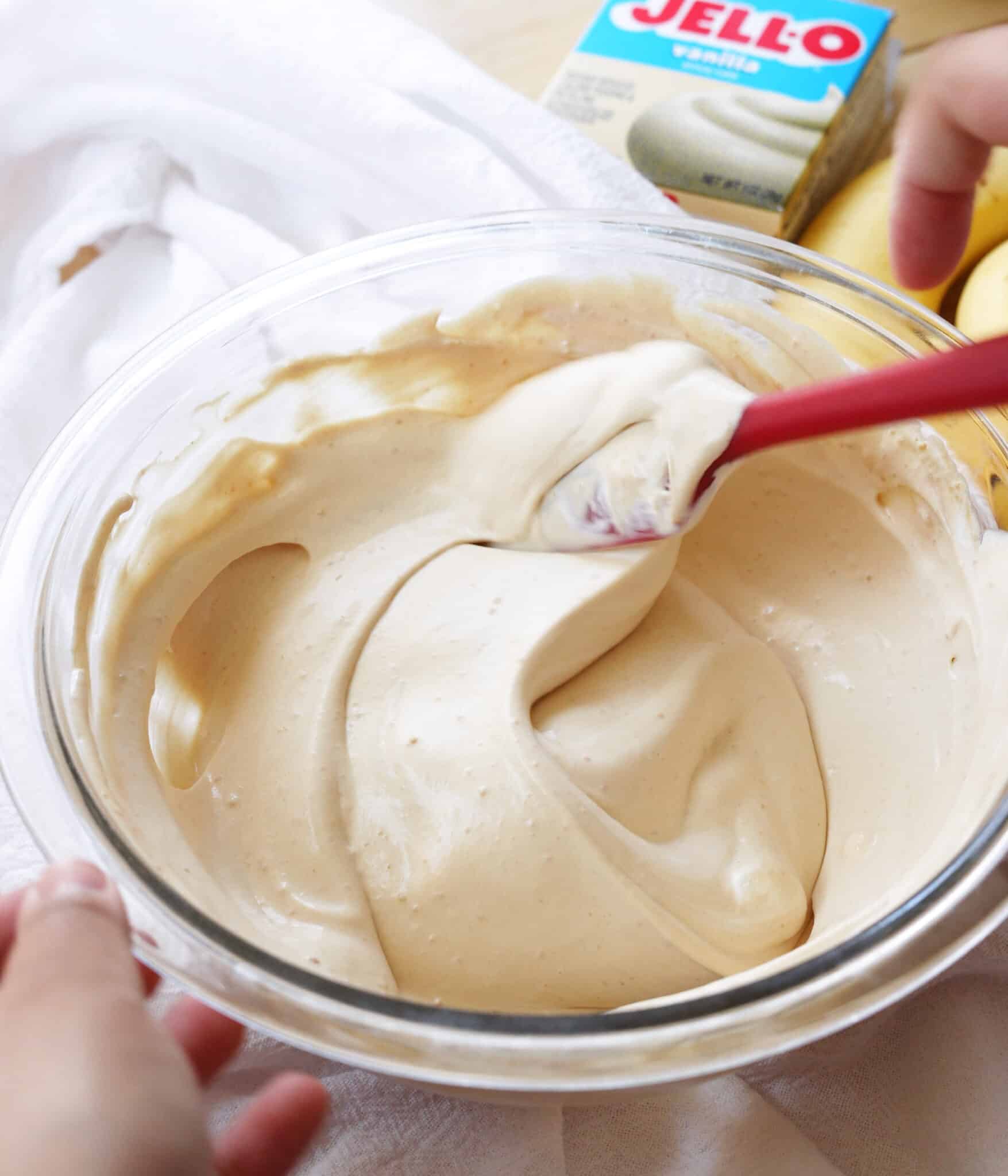 Light and creamy earl grey pudding mixture in a glass bowl.