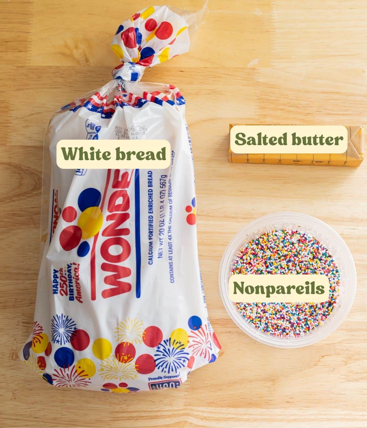 Fairy bread labeled ingredients on a wooden table.