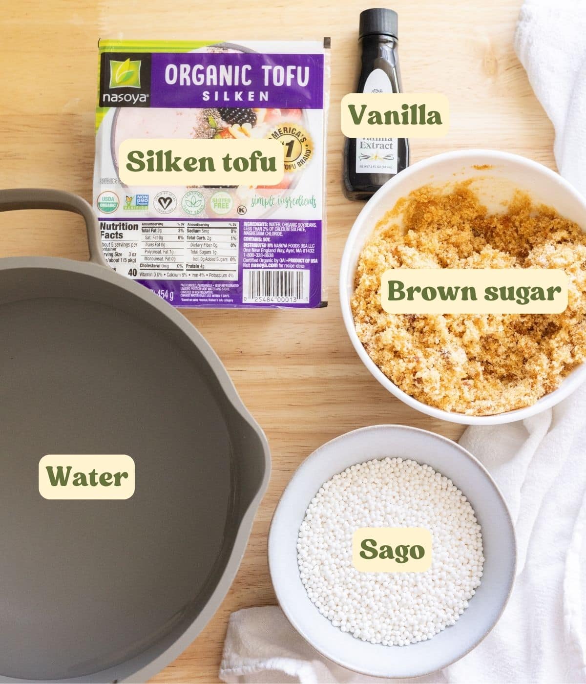 Filipino taho labeled ingredients on a wooden table.