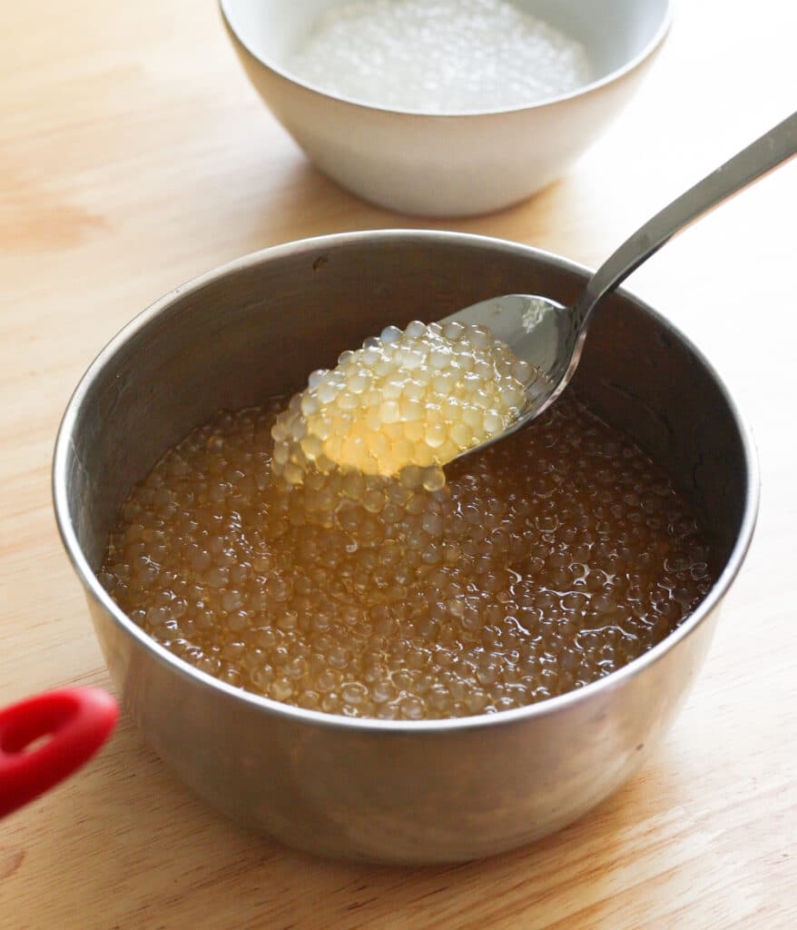 Cooked small tapioca pearls soaked in arnibal.