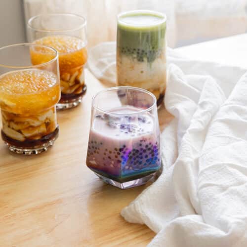 Homemade ube taho in a glass cup.