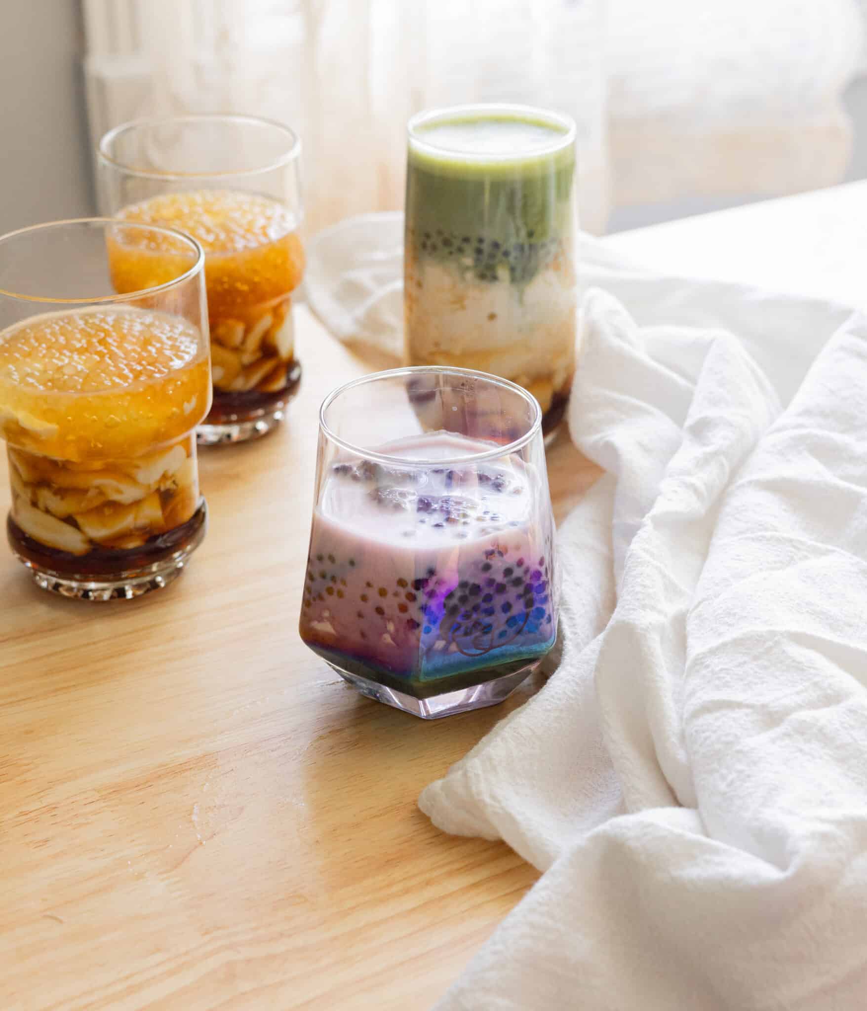 Homemade ube taho in a glass cup.