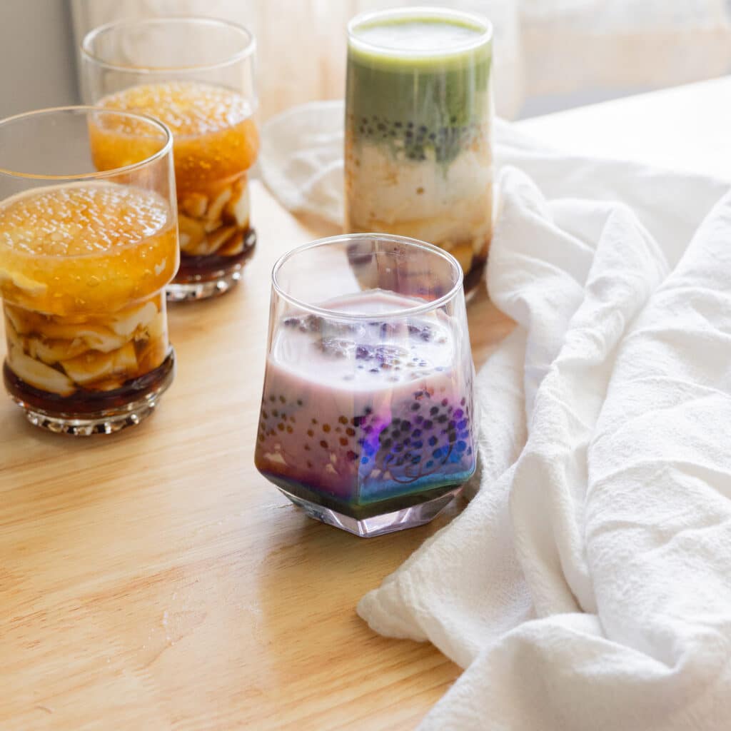 Homemade ube taho in a glass cup.