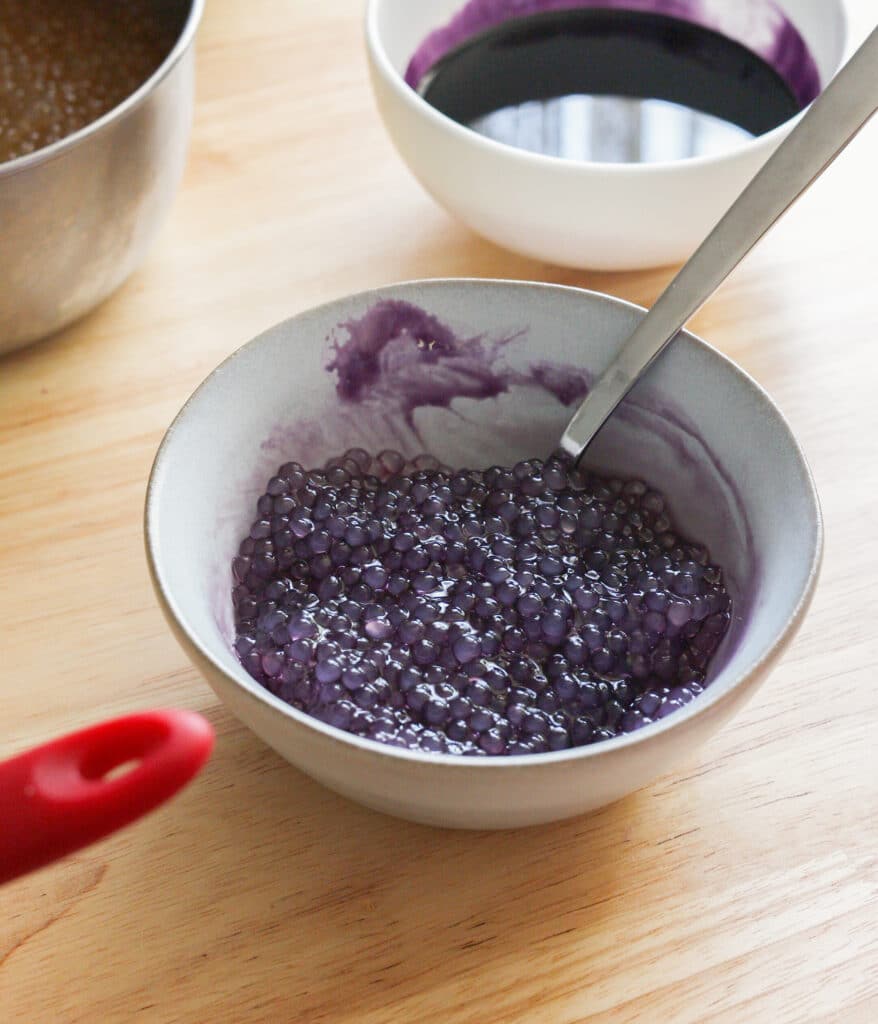 Cooked small tapioca pearls soaked in ube arnibal.