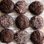 Chocolate sprinkle cookies on a wire rack.