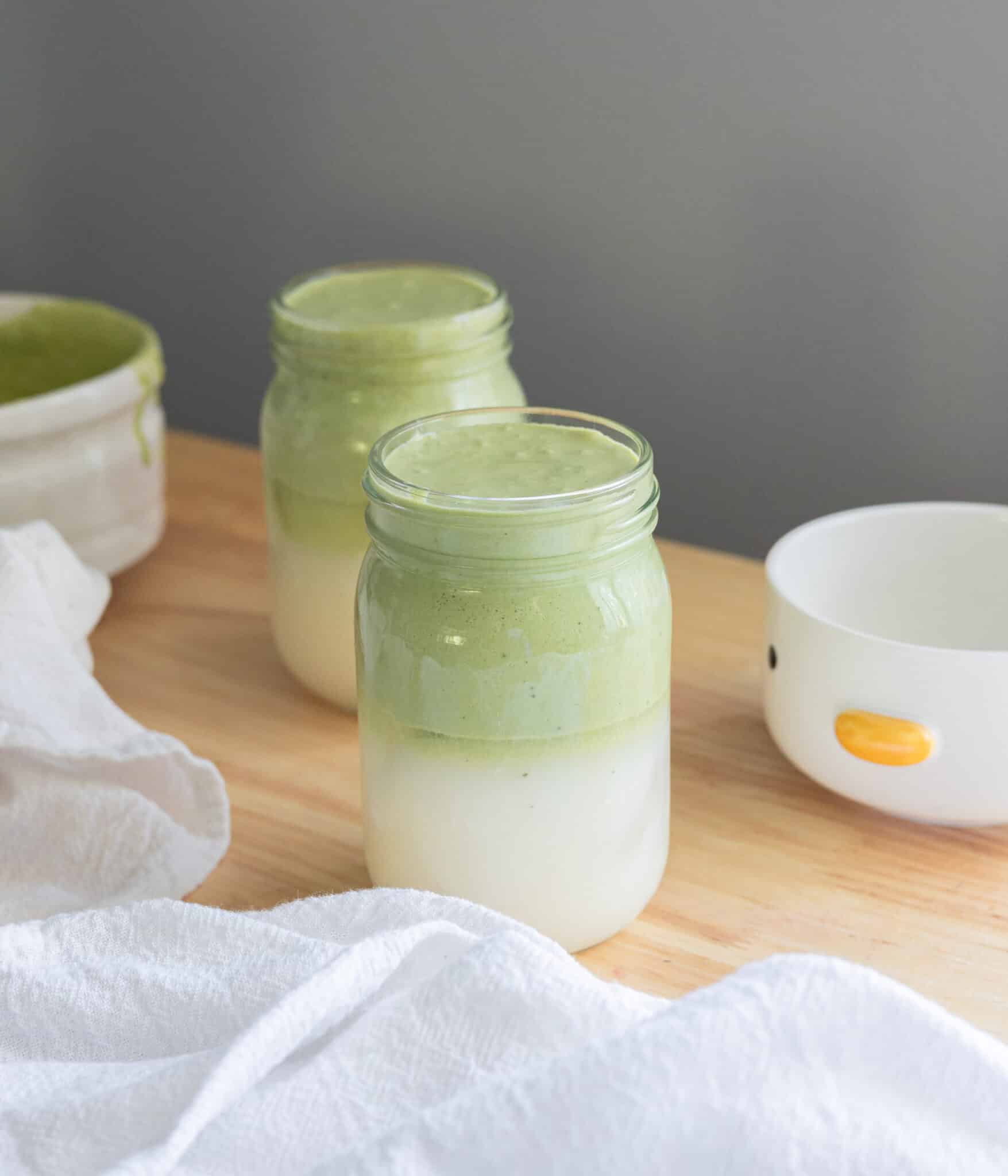 Coconut water matcha cloud drink in a mason jar.