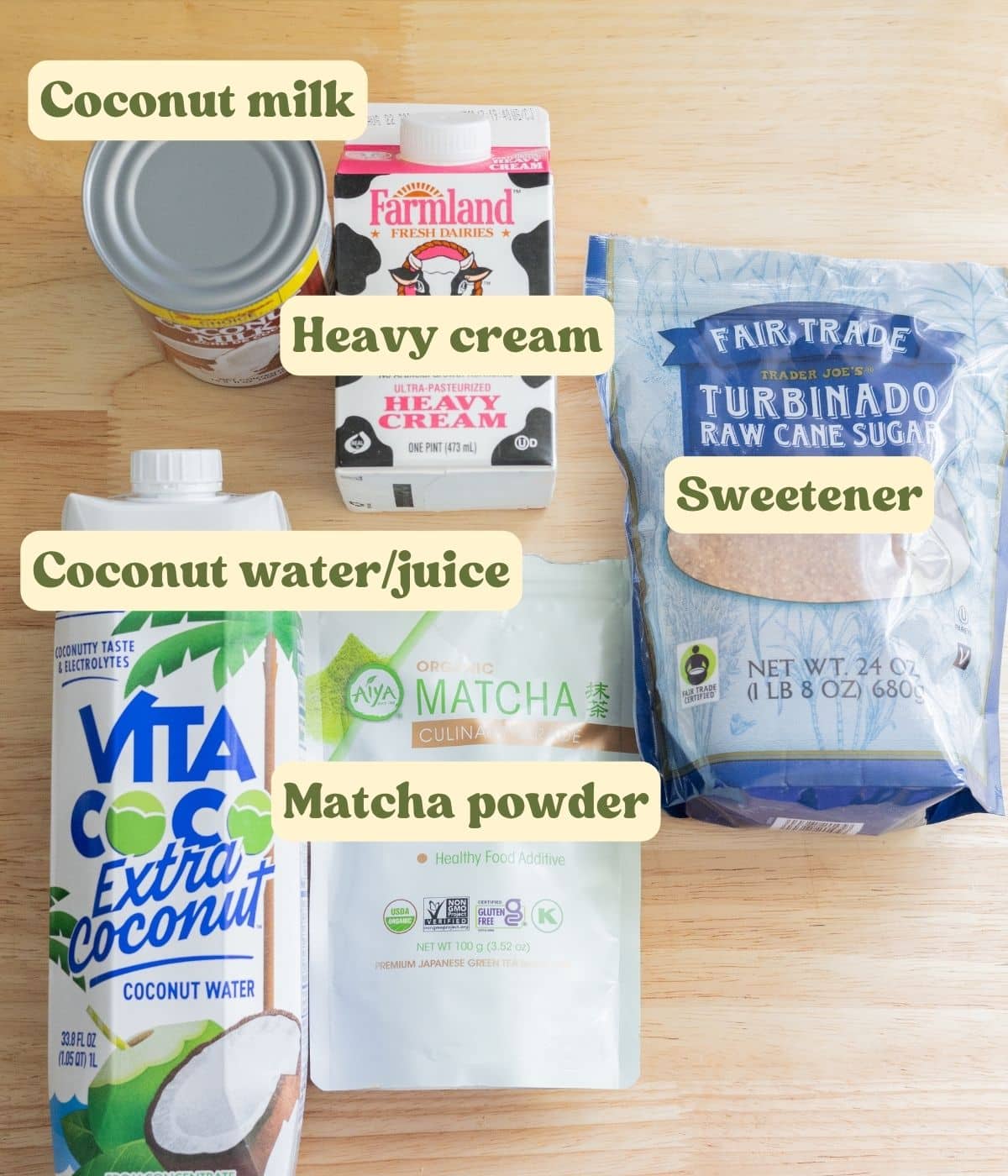 Coconut matcha cloud labeled ingredients laid out on a wooden table.