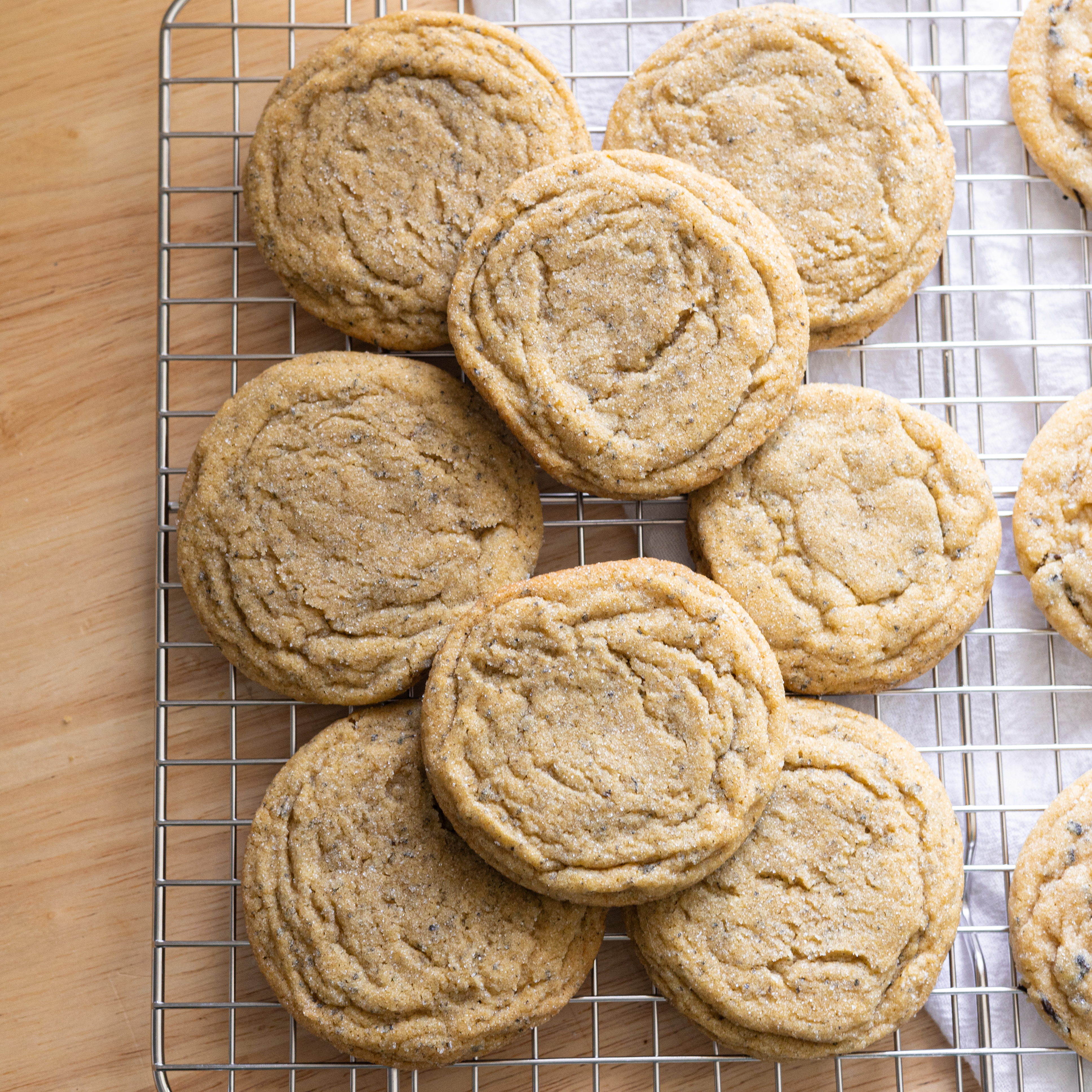 Jasmine sugar cookies laid out on a wire rack.