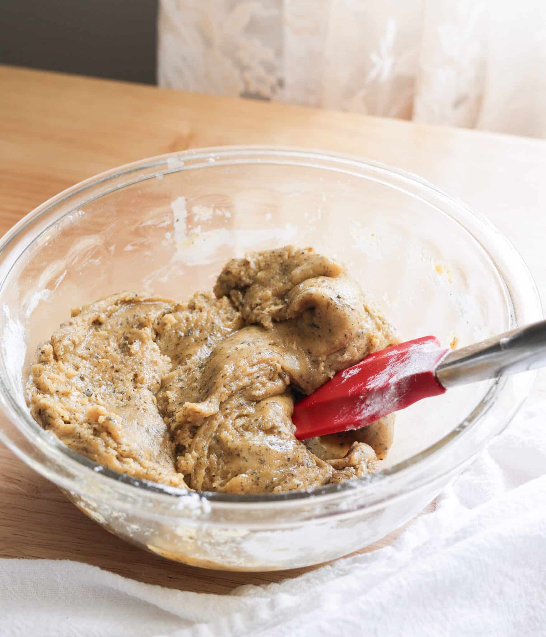 Jasmine sugar cookie dough in a glass mixing bowl.