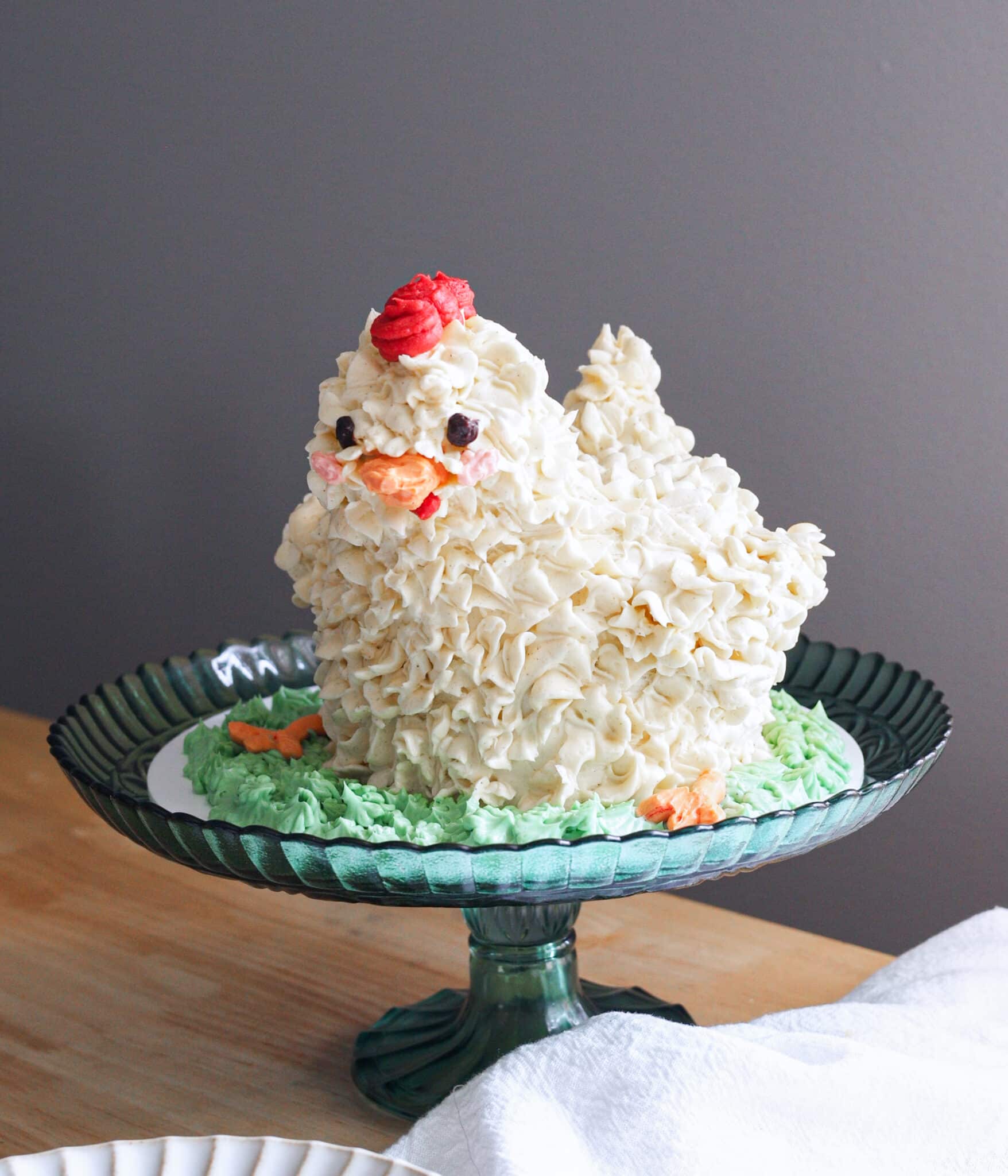 Cute chicken cake on a green cake stand.