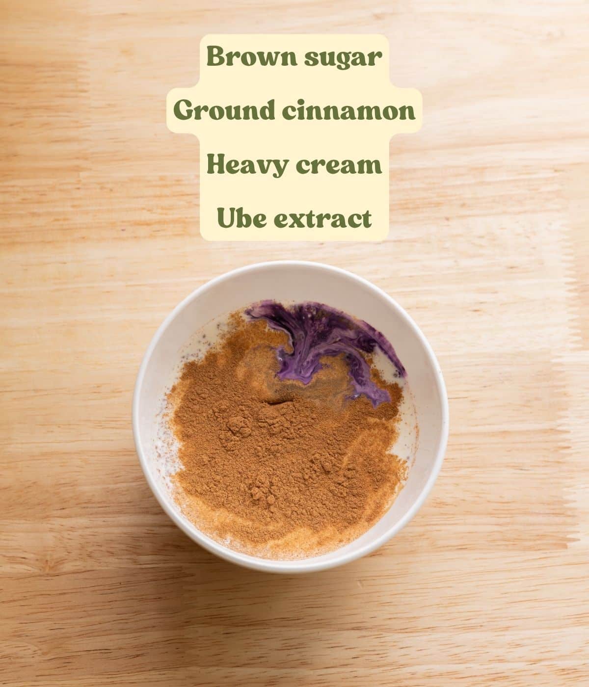 Labeled ube cinnamon roll heavy cream ingredients laid out on a table.