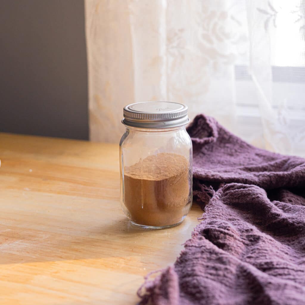 Apple pie spice mix ingredients in a little jar.