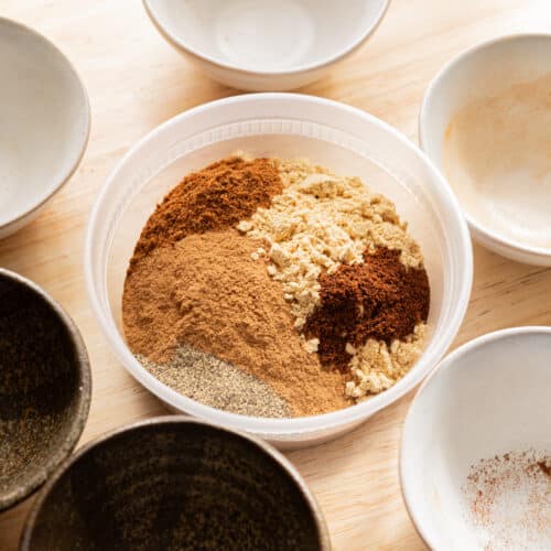 Chai spice mix ingredients in a plastic container.