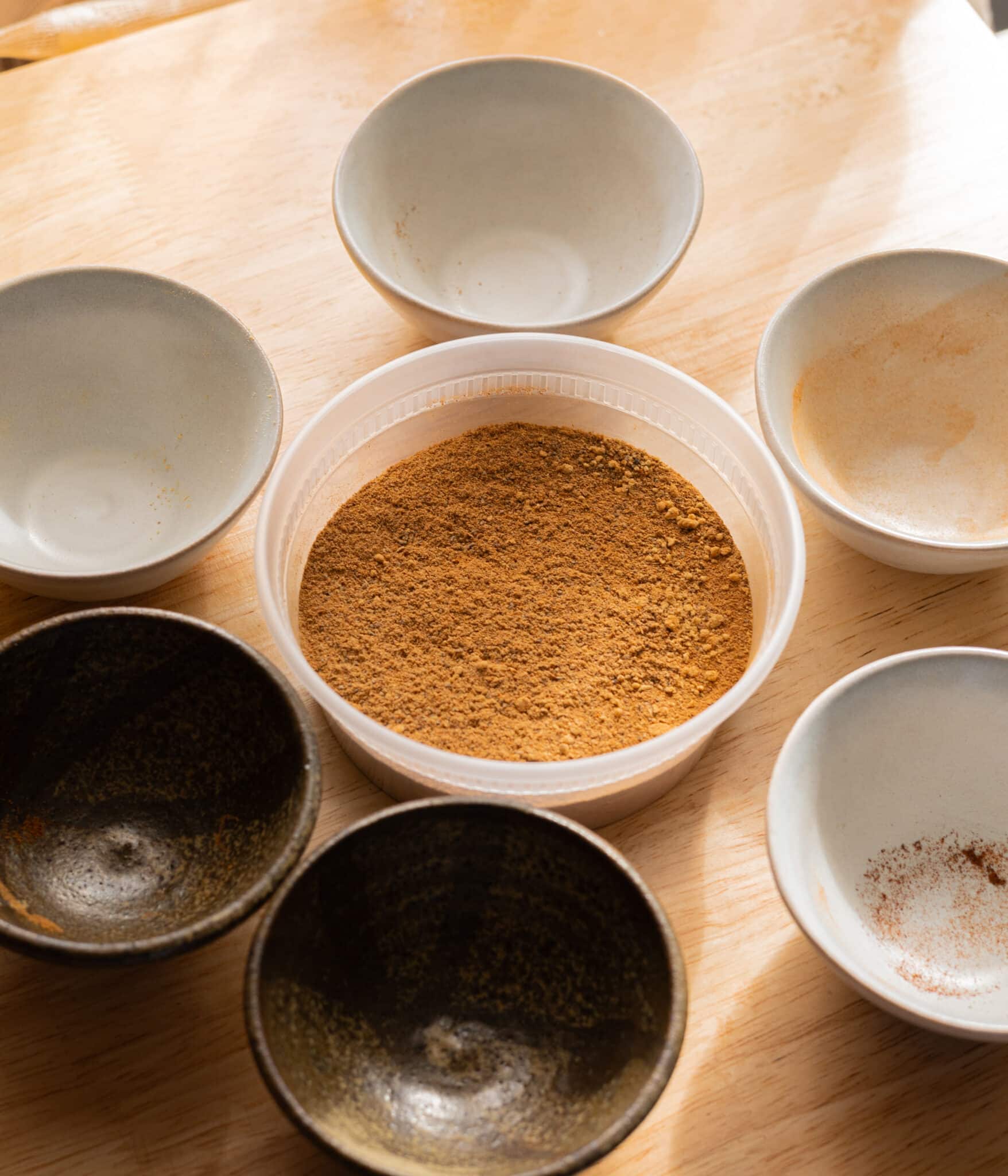 Mixed chai spice in a plastic container.