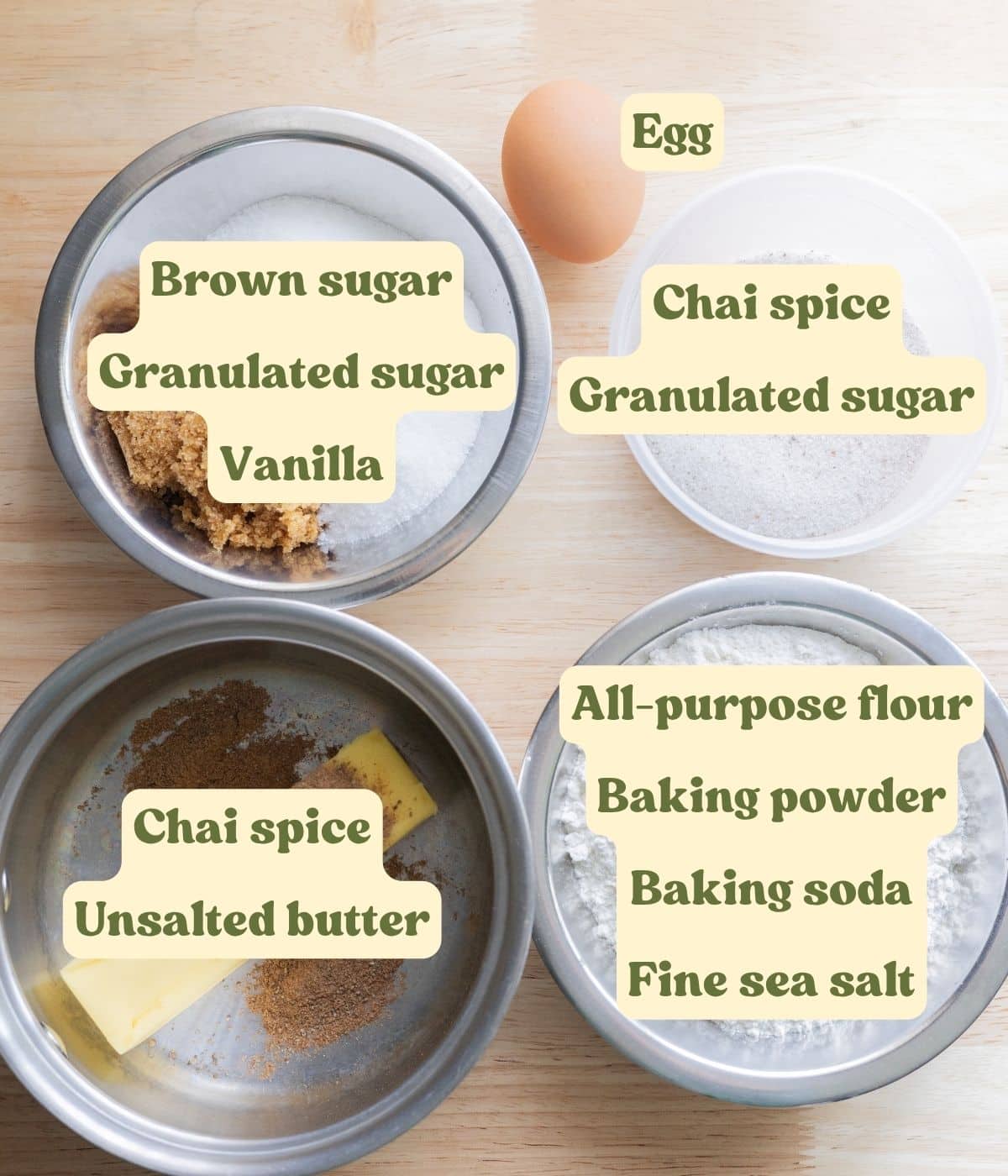 Chai sugar cookie ingredients laid out on a table with labels.