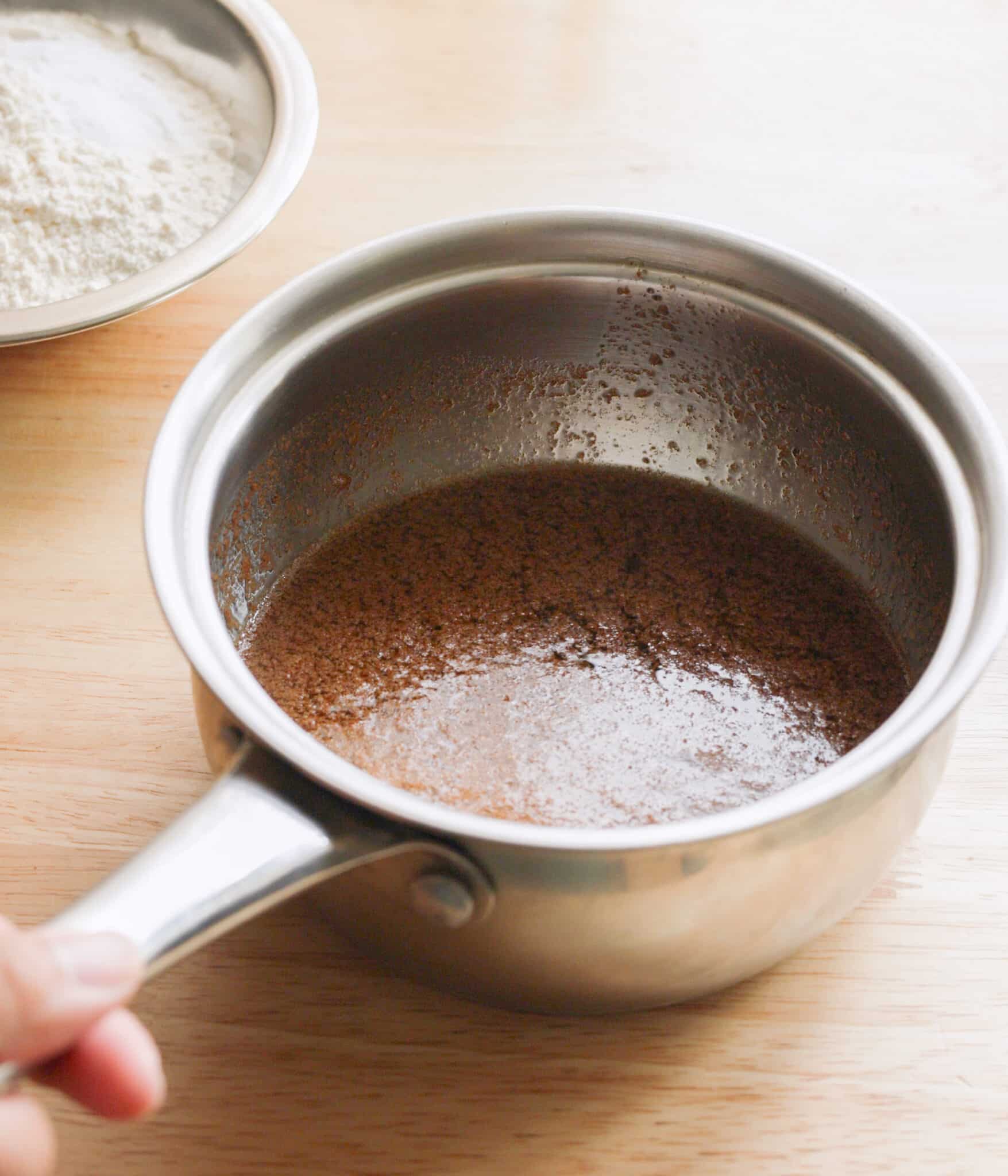 Melted butter and chai spice in a pot.
