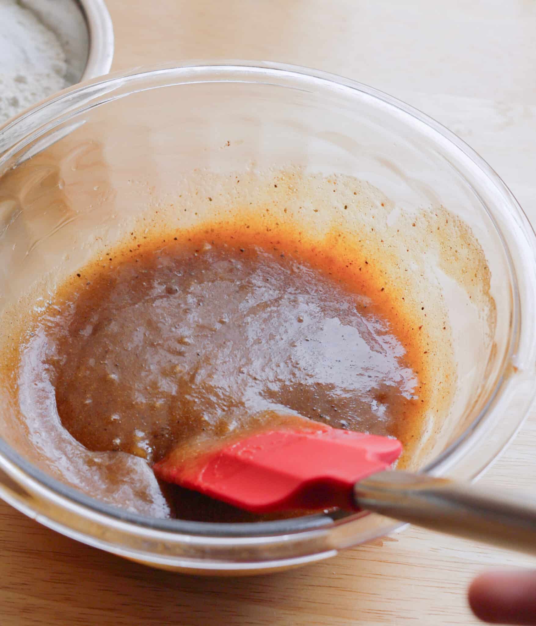 Chai sugar cookie wet ingredients mixed in a glass bowl.
