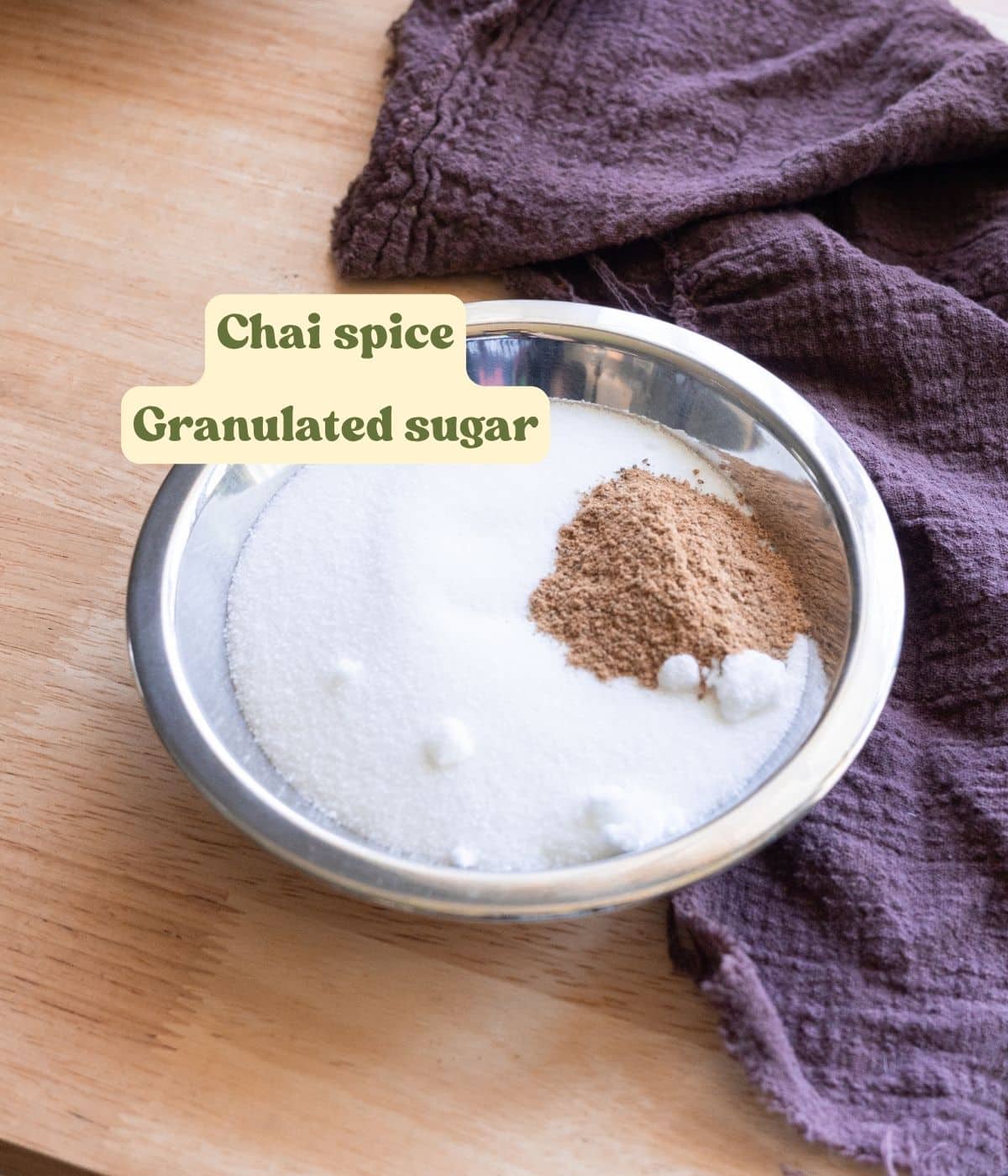 Chai sugar ingredients laid out on a table with labels.