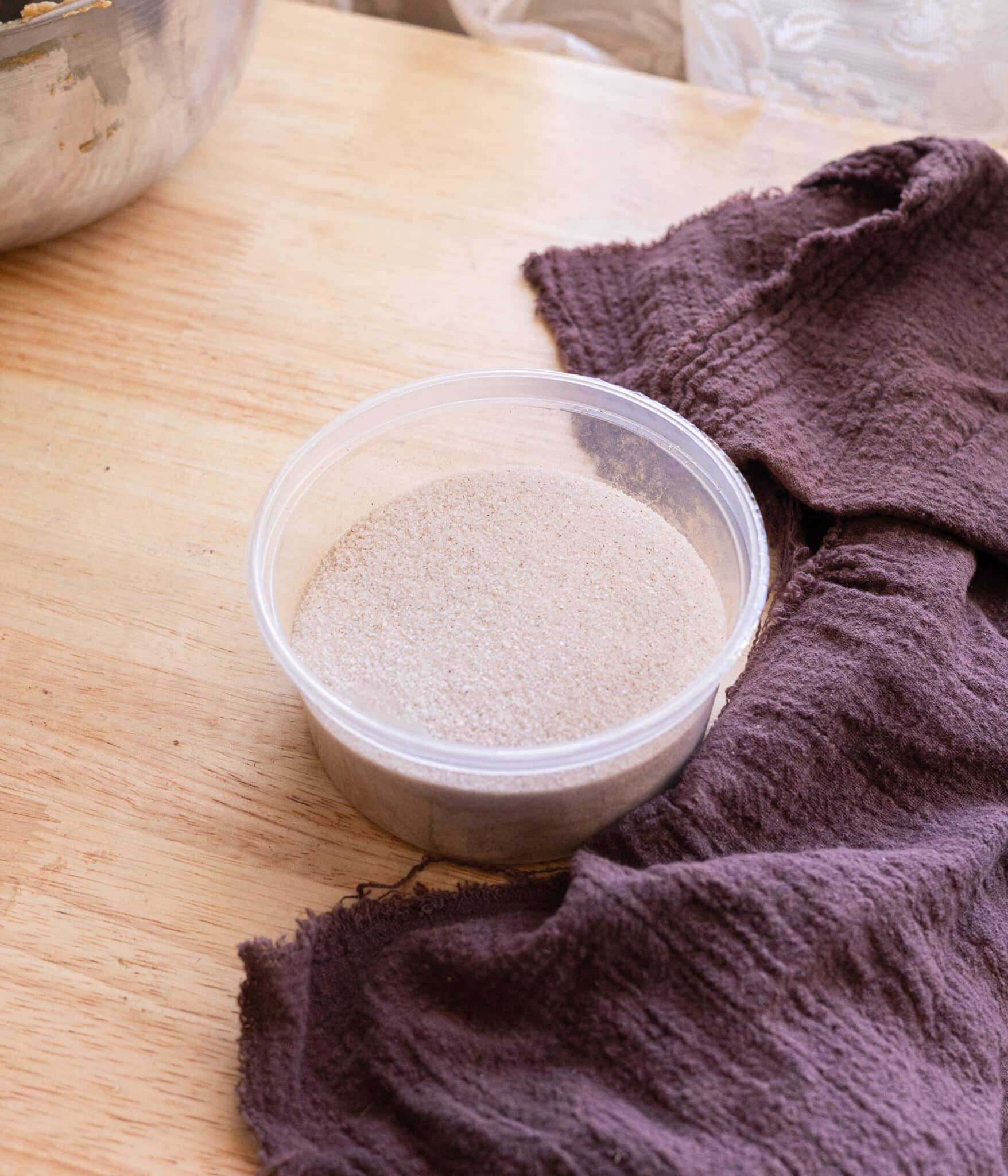 Cinnamon sugar in a plastic container.