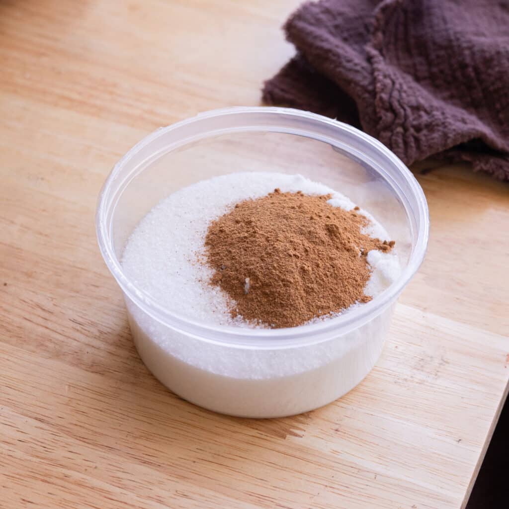 Cinnamon sugar in a plastic container.
