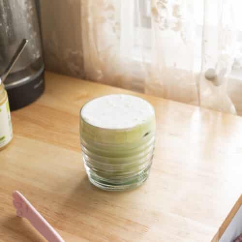 Coconut cold foam on top of a matcha latte.